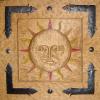 Hand carved sun face.